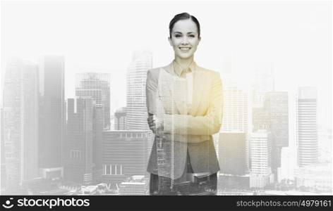 business, people and corporate concept - smiling businesswoman over city buildings background and double exposure effect. smiling businesswoman over city buildings