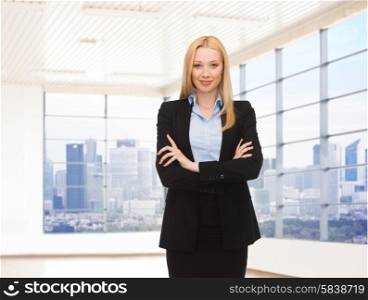 business, people and education concept - young smiling businesswoman over office room or new apartment background