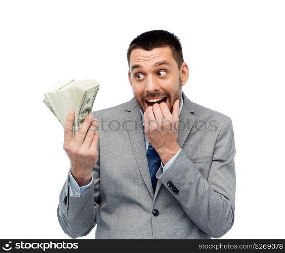 business, people and finances concept - astonished businessman with bundle of american dollar cash money. smiling businessman with american dollar money
