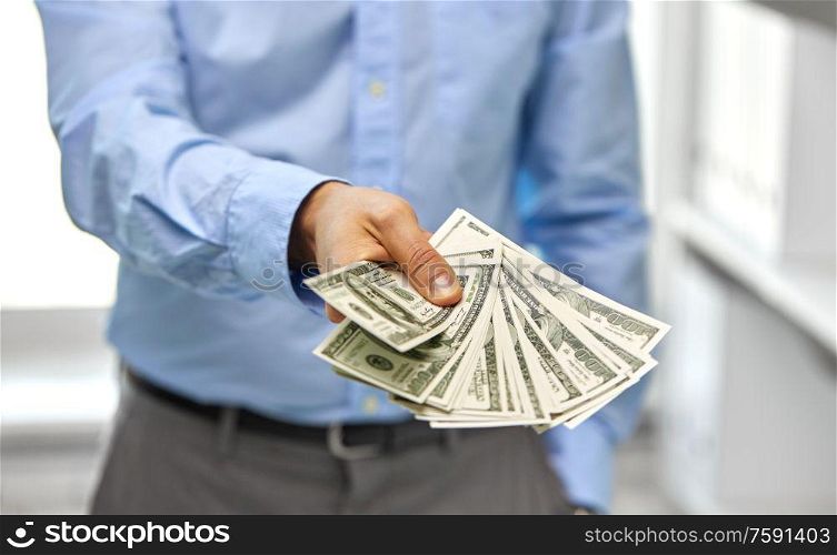 business, people and finances concept - close up of businessman with american dollar money. close up of businessman with american dollar money
