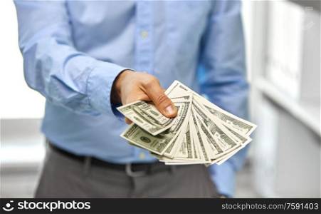 business, people and finances concept - close up of businessman with american dollar money. close up of businessman with american dollar money