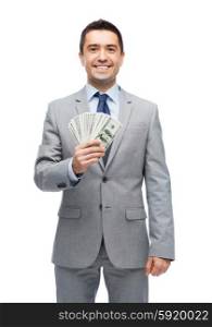 business, people and finances concept - smiling businessman with american dollar money