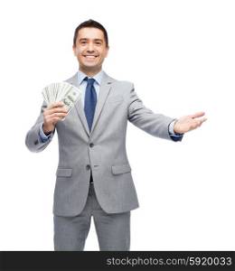 business, people and finances concept - smiling businessman with american dollar money