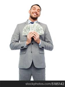 business, people and finances concept - smiling businessman with bundle of american dollar cash money. smiling businessman with american dollar money