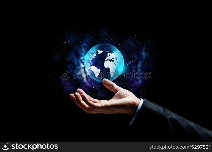 business, people and future concept - close up of businessman hand with earth globe projection over space background. close up of businessman hand with earth projection