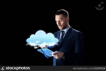 business, people and future technology concept - businessman in suit working with transparent tablet pc computer and virtual cloud hologram over black background. businessman with tablet pc and cloud hologram