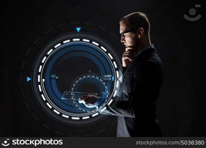 business, people and future technology concept - businessman with transparent tablet pc computer and virtual projection over black background. businessman with transparent tablet pc