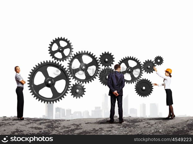 Business people and mechanism elements. Businessman and businesswoman with cog wheel elements. Organization concept