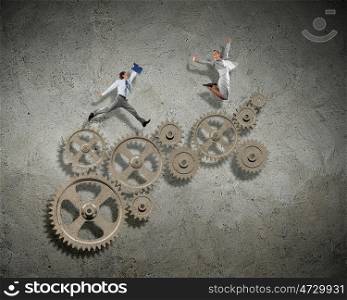 Business people and mechanism elements. Businessman and businesswoman with cog wheel elements. Organization concept