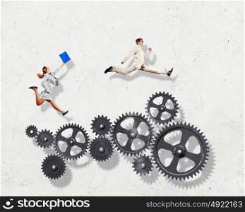 Business people and mechanism elements. Businessman and businesswoman with cog wheel elements. Organization concept