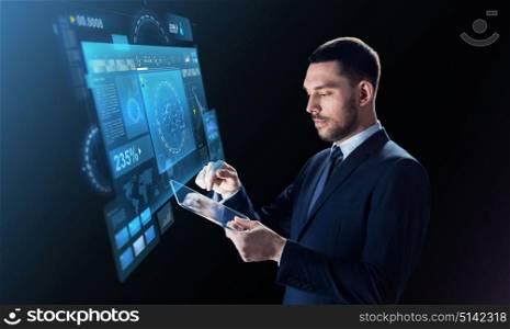 business, people and modern technology concept - businessman in suit working with transparent tablet pc computer and virtual screen projection over black background. businessman in suit with transparent tablet pc