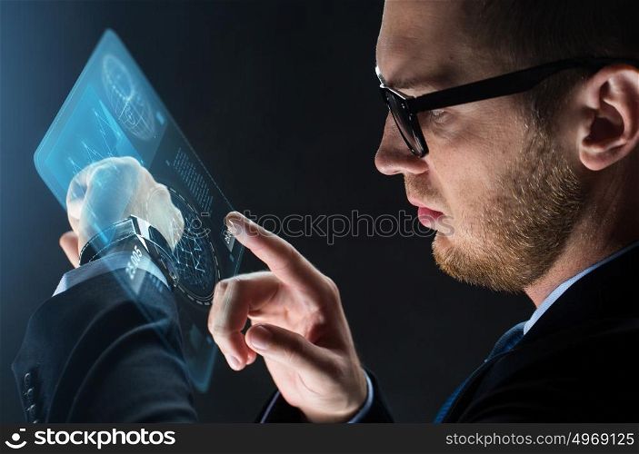 business, people and modern technology concept - close up of businessman with smart watch and virtual screen projection over black background. close up of businessman with smart watch