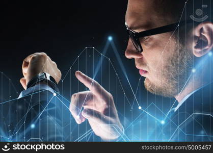 business, people and modern technology concept - close up of businessman with smartwatch and diagram chart virtual projection over black background. close up of businessman with smartwatch