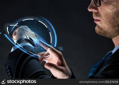 business, people and modern technology concept - close up of businessman with smartwatch and virtual projection over black background. close up of businessman with smartwatch