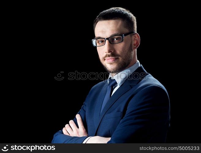 business, people and office concept - businessman in glasses over black background. businessman in glasses over black