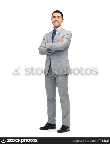 business, people and office concept - happy smiling businessman in suit