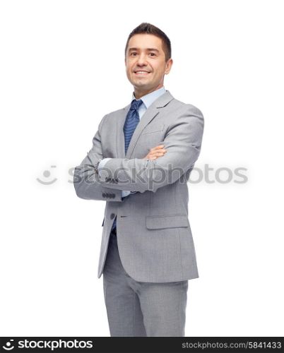 business, people and office concept - happy smiling businessman in suit