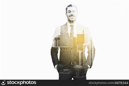 business, people and office concept - happy smiling businessman over city and double exposure effect. happy smiling businessman