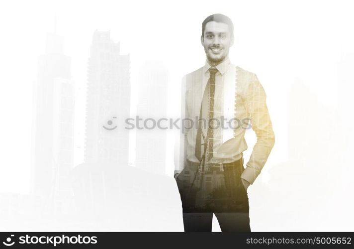 business, people and office concept - happy smiling businessman over city and double exposure effect. happy smiling businessman