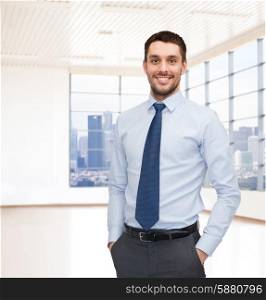 business, people and office concept - happy young businessman over office room or new apartment background