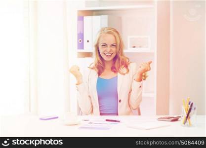 business, people and success concept - happy businesswoman celebrating triumph at office. happy businesswoman celebrating success at office. happy businesswoman celebrating success at office