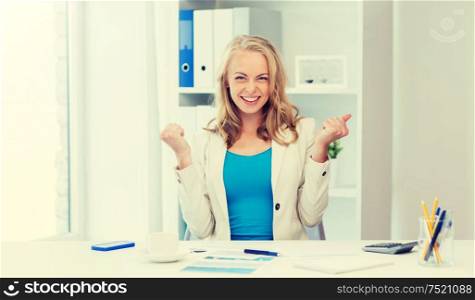 business, people and success concept - happy businesswoman celebrating triumph at office. happy businesswoman celebrating success at office