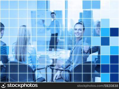 business, people and success concept - smiling businesswoman with team in office showing thumbs up over blue squared grid background