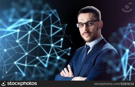 business, people and technology concept - businessman in glasses over black background with low poly shape projection. businessman in glasses over black