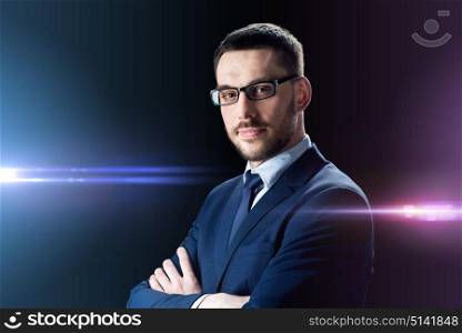 business, people and technology concept - businessman in glasses over black background. businessman in glasses over black