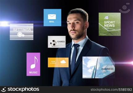 business, people and technology concept - businessman in suit over black background with virtual applications. businessman in suit over black