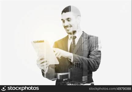 business, people and technology concept - businessman in suit working with tablet pc computer over city and double exposure effect. businessman in suit working with tablet pc