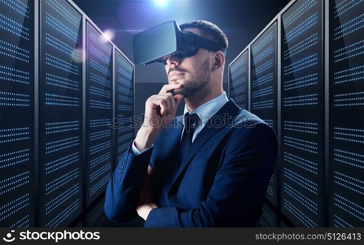 business, people and technology concept - businessman in virtual reality headset over futuristic server room background. businessman in virtual reality headset