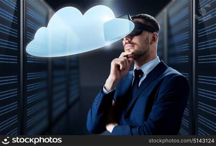 business, people and technology concept - businessman in virtual reality headset with cloud computing icon over futuristic server room background. businessman in virtual reality headset with cloud