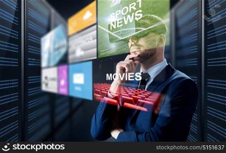 business, people and technology concept - businessman in virtual reality headset with multi media projection over futuristic server room background. man in virtual reality headset with multimedia