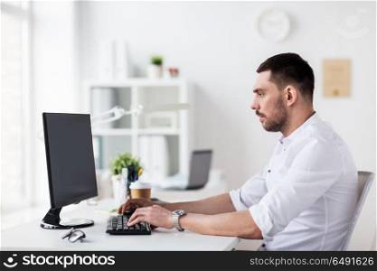 business, people and technology concept - businessman typing on computer keyboard at office. businessman typing on computer keyboard at office. businessman typing on computer keyboard at office