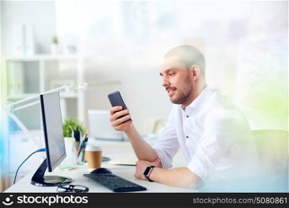 business, people and technology concept - businessman with smartphone and computer at office. businessman with smartphone and computer at office