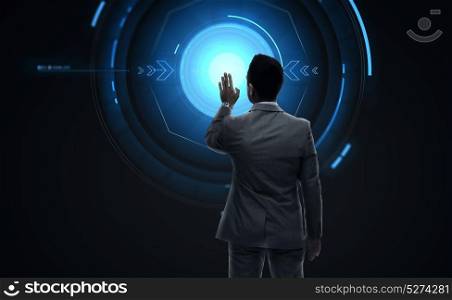 business, people and technology concept - businessman working with virtual screen from back over black background. businessman working with virtual reality screen