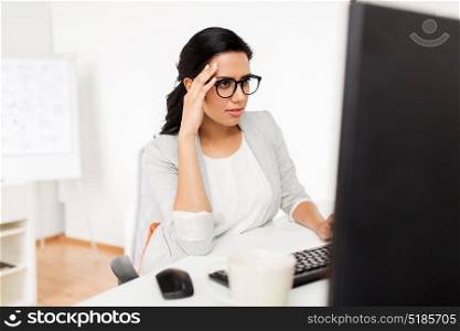 business, people and technology concept - businesswoman with computer working at office. businesswoman with computer working at office