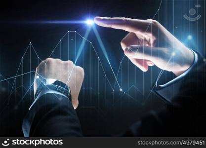 business, people and technology concept - close up of businessman hands with smartwatch and diagram chart virtual projection over black background. close up of businessman hands with smartwatch