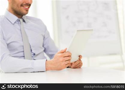 business, people and technology concept - close up of businessman hands with tablet pc computer at office