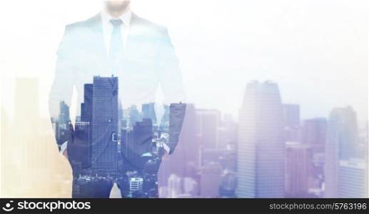 business, people and technology concept - close up of businessman over city background