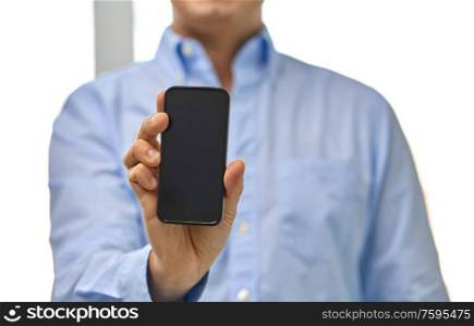 business, people and technology concept - close up of businessman showing smartphone black blank screen. businessman showing smartphone screen