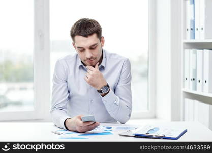 business, people and technology concept - close up of businessman with smartphone