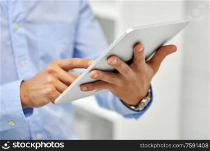 business, people and technology concept - close up of male hands with tablet pc computer. close up of male hands with tablet pc computer