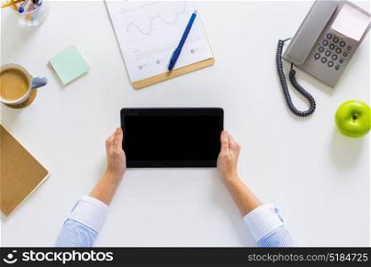 business, people and technology concept - hands of businesswoman with tablet pc computer working at office. hands of businesswoman with tablet pc at office