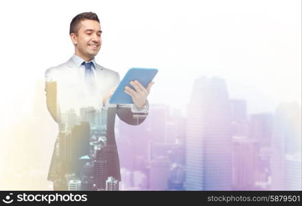 business, people and technology concept - happy smiling businessman in suit holding tablet pc computer over city background with double exposure