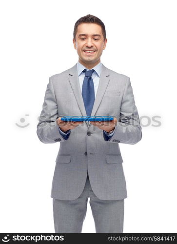 business, people and technology concept - happy smiling businessman in suit holding tablet pc computer