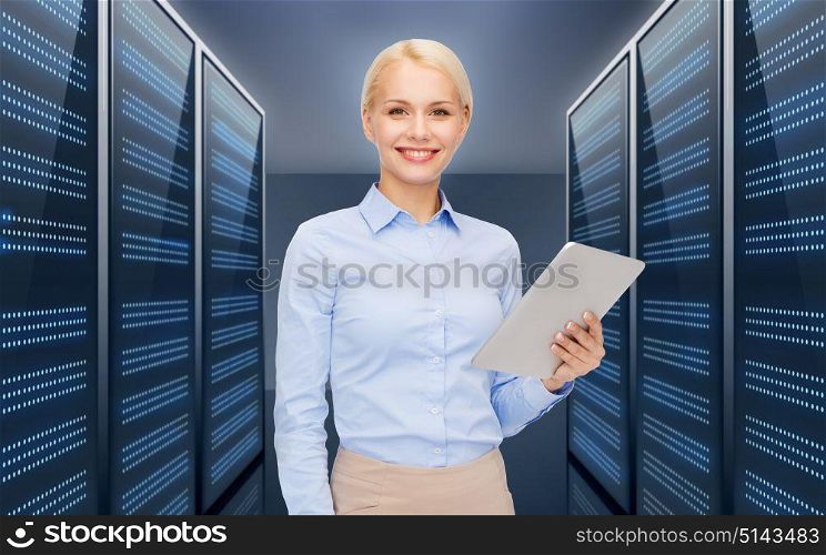 business, people and technology concept - happy smiling businesswoman holding tablet pc computer over futuristic server room background. businesswoman with tablet pc over server room