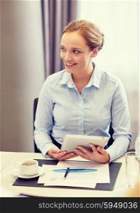 business, people and technology concept - smiling woman with tablet pc computer, papers and cup of coffee in office