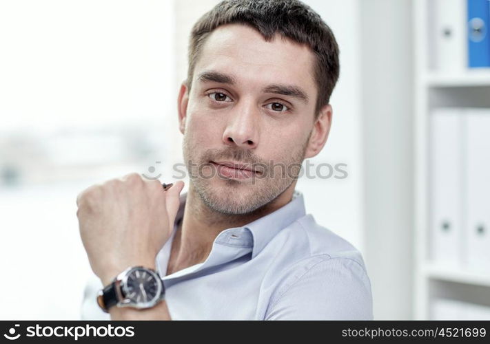 business, people and work concept - portrait of businessman in office